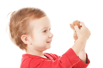 Boy playing with teddy bear isolated on white