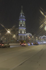 Fototapeta na wymiar ST. PETERSBURG, RUSSIA - DECEMBER 21, 2017. Nevsky Prospect at night Christmas illumination. Night Snowfall. It is the main street in Saint Petersburg.