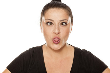 funny chubby woman making face on white background