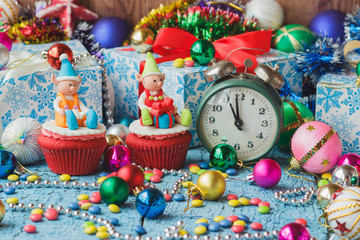 Christmas cupcakes with colored decorations made from confectionery mastic