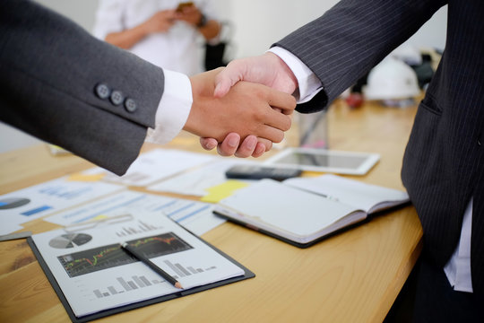 Acquisition Business People Shaking Hands, Finishing Up A Meeting.