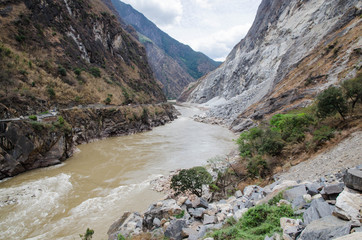 Naklejka na ściany i meble The torrential flow through the hills in Tibet