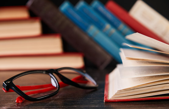 Books with books and glasses