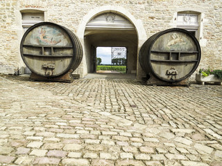 Chateau de Pommard, Pommard, Burgundy, France. The court of the castle with two big wine barrels.