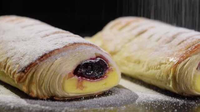 Baked dough rolls with powdered shugar