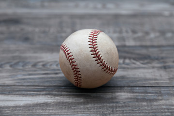 Baseball on a old rustic wooden desk with copy space background