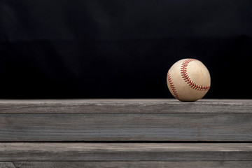 Baseball on a old rustic wooden desk with copy space background