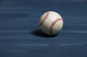 Baseball on a old chalkboard desk surface with copy space background