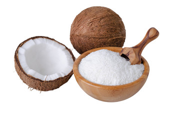 coconut flakes in a wooden bowl with scoop isolated on white