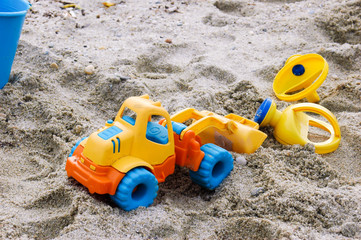plastic truck, kids toy on beach