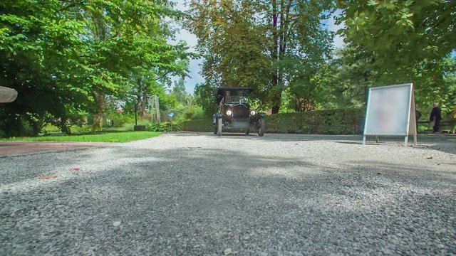 Sightseeing tour of beautiful flower park with a replica of a special historical car Ford model T.