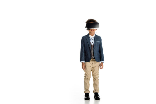 adorable african american child standing with virtual reality headset on white