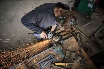 young farmer working with a grinder