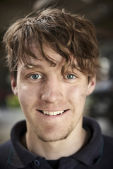 Happy working young farmer