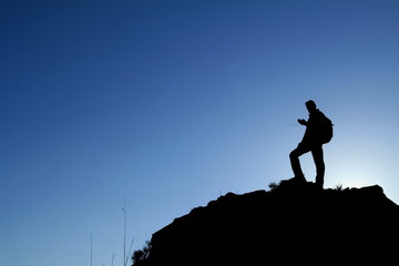 man hill sunset smartphone sun