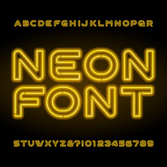 Neon alphabet font. Yellow letters and numbers. Vector typeface for your headers or any typography design.