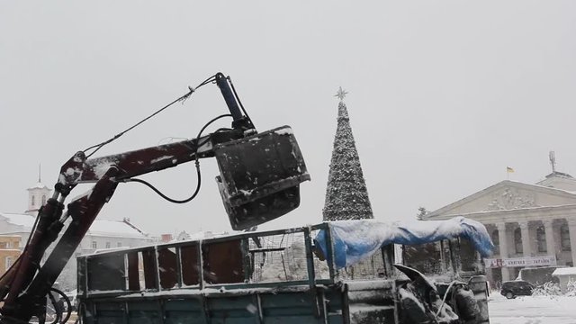 snow-removal bucket in operation