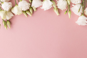 Fototapeta na wymiar White roses on pink background