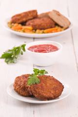 Meatballs on white dish.