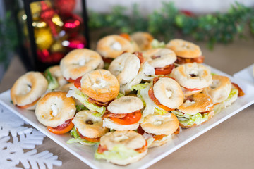 christmas snack donit bread with meat and vetgy with blur decorate red and yellow background