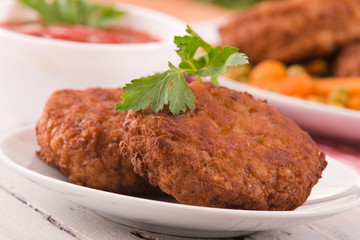 Meatballs on white dish.