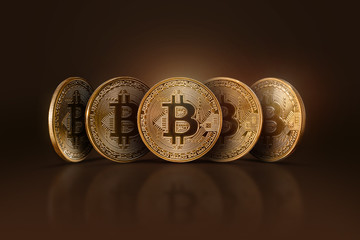 Five real Bitcoin coins on a dark background. Electronic money, crypto currency.