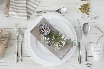 Christmas table setting on wooden background