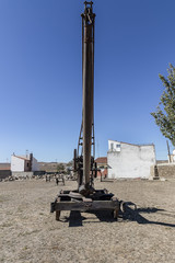 Rusty old winch crane used in a stone quarry