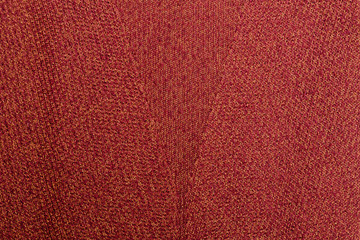 Red orange texture. Knitted fabric with pattern