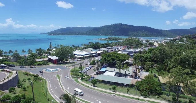 WHITSUNDAY ISLANDS &ndash; FEBRUARY 2016 : Aerial shot over Airlie Beach cityscape on a beautiful day with boats and beach in view