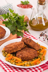 Meatballs on white dish.