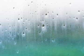 Water drops on misted glass 