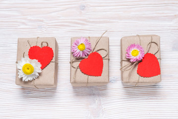 Valentine day three gift boxes on wooden background