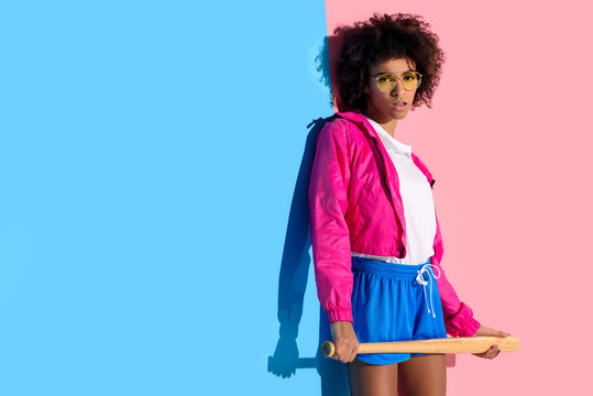 Young Bright African American Girl Holding Baseball Bat