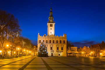 Naklejka na ściany i meble Old town square with historical town hall in Chelmno at night, Poland