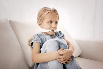 Helpless little girl with gag in mouth indoors. Child abuse concept - obrazy, fototapety, plakaty