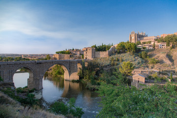 View of old stone bridge Puente de San Mart&iacute;n in Toledo, Spain