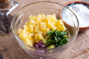 Pineapple salsa in a glass bowl. Preparation