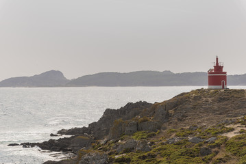 Fototapeta na wymiar Lighthouse of Punta Robaleira, in Cabo Home (Cangas de Morrazo, Pontevedra - Spain).