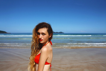 portrait young caucasian woman in swimsuit on the beach, Brazil
