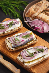 Herring sandwiches with pickled cucumber.