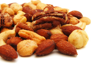 Mix of nuts close up on white