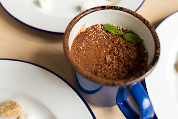 Variety of desserts on the table with white plates and marshmallows. Cherry, chocolates