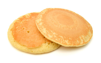 Two of plain pancakes on a white background.