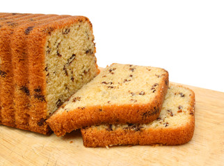 Sliced butter cake on white background