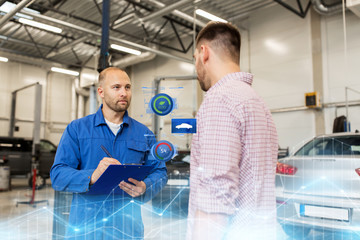 auto mechanic with clipboard and man at car shop