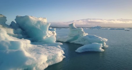 POV aerial flight between glaciers Jökulsárlón glacial lagoon Iceland 4K UHD