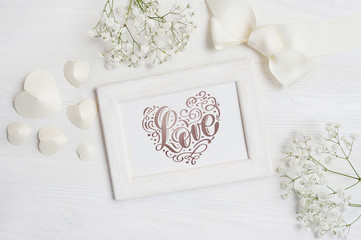 Wooden frame with the inscription Love card for St. Valentine's Day in rustic style with place for your text, Flat lay, top view photo
