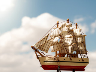 close-up sailing ship with cloudy bacground