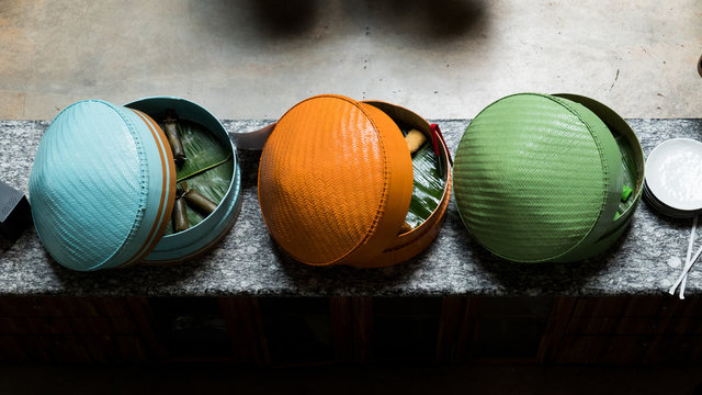 Blue, orange, and green traditional Indonesian basket.
